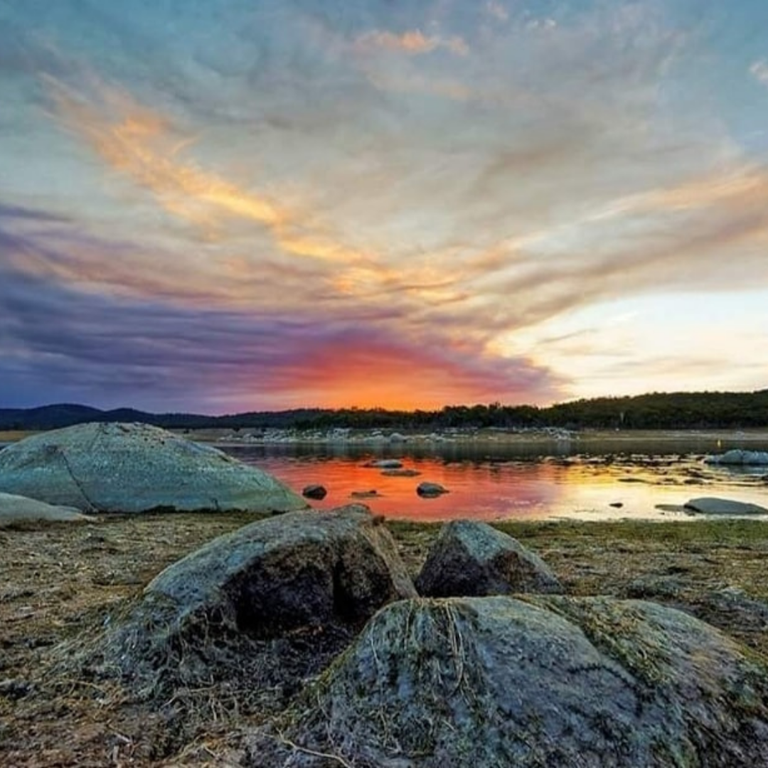 lake leslie tourist park lake leslie dam sunset on the water over rocks