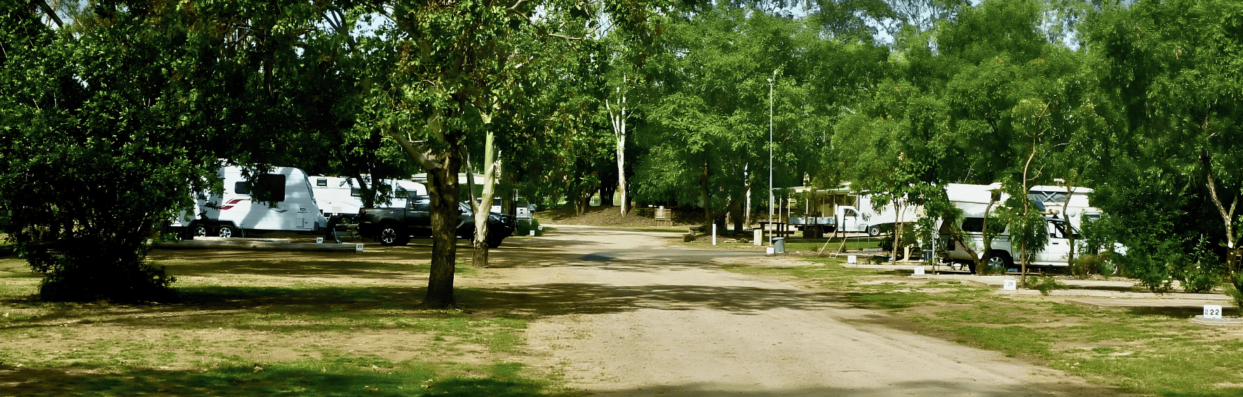 monto caravan and cabin park banner caravan and road