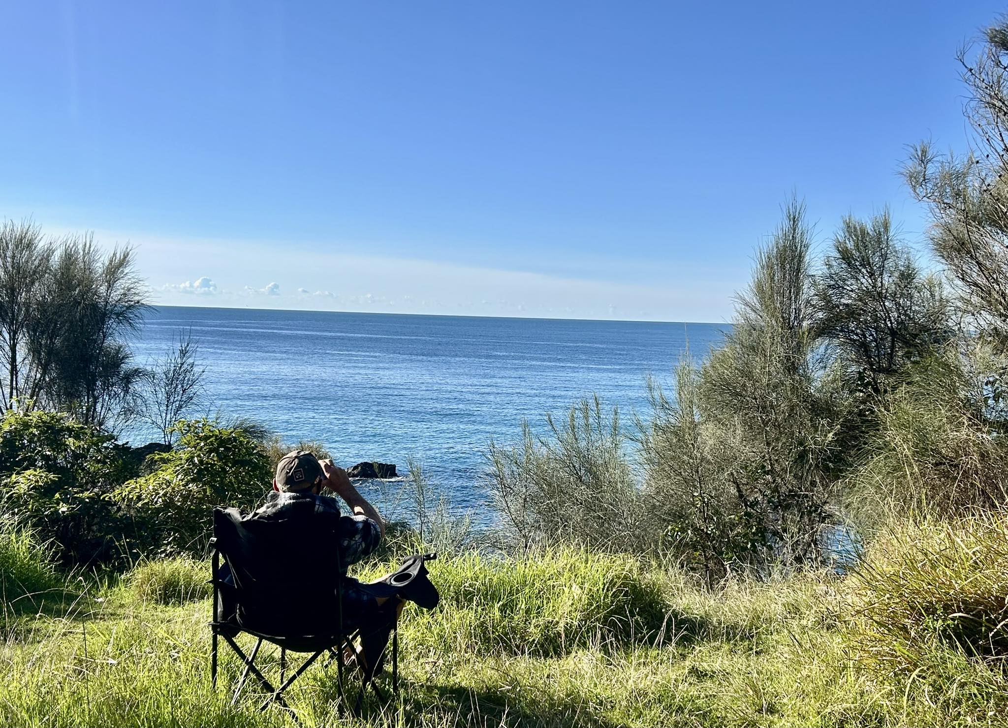 mystery bay campground person on camp chair looking out to sea